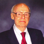 Dr. E. Vernon Smith